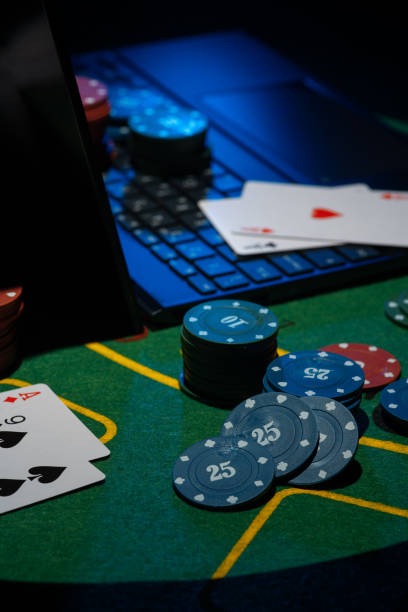 Mobile phone displaying NetEnt baccarat game with Banker, Player, and Tie betting buttons